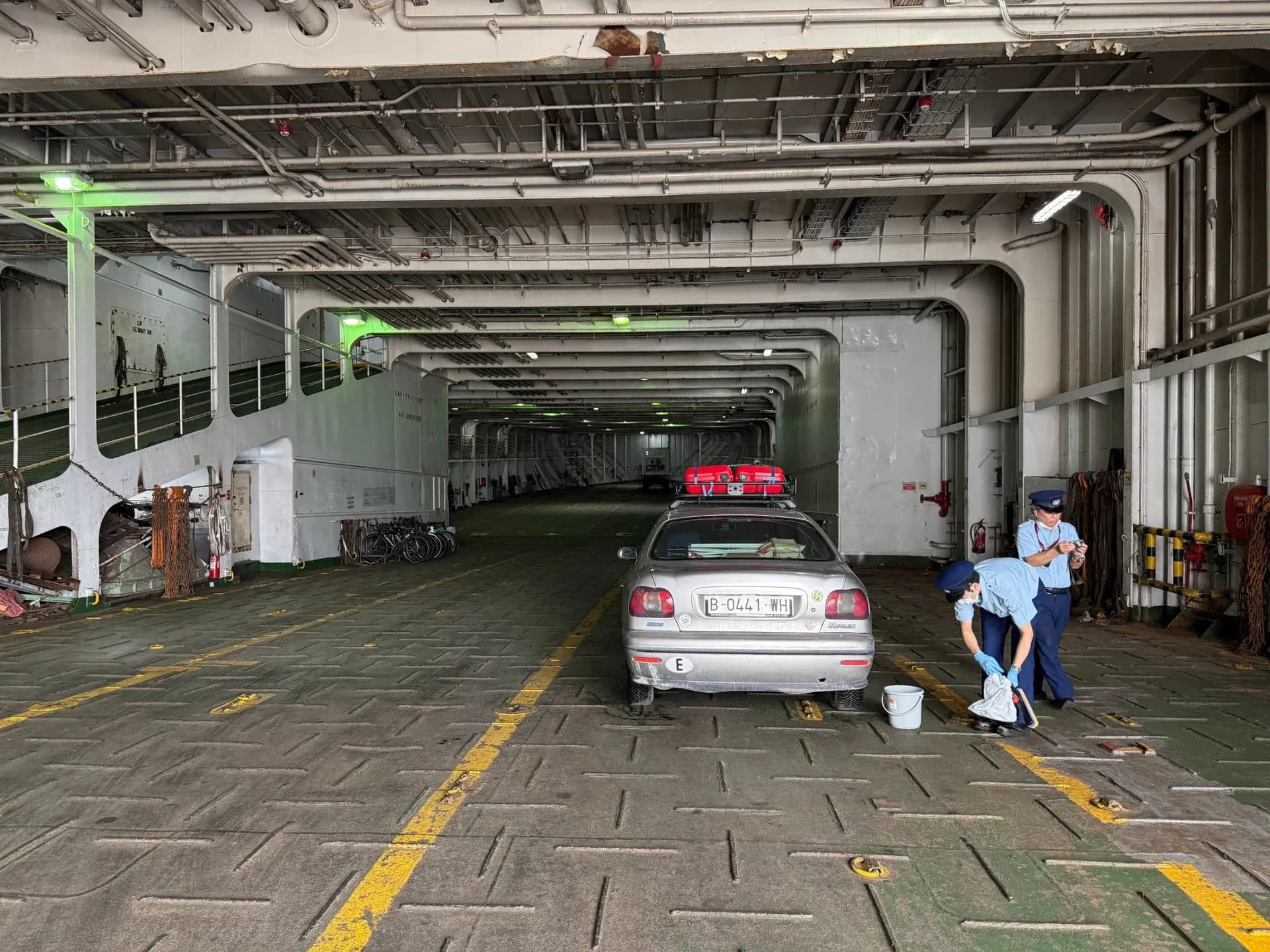 The Marea and two customs staff on the ferry on arrival in Japan